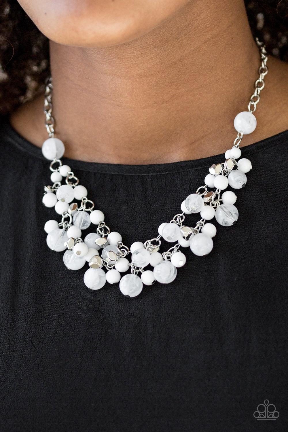 Paparazzi Accessories Gone Sailing - White Featuring polished and cloudy finishes, refreshing white beads drip from the bottom of two shimmery silver chains below the collar. Faceted silver beads trickle between the colorful accents, adding a splash of me