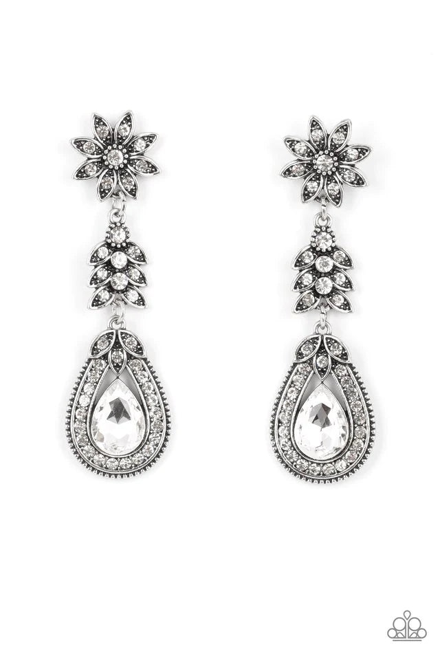 Paparazzi Accessories Floral Fantasy - White Dotted in dainty white rhinestones, a studded silver flower gives way to a leafy frame that is delicately suspended above a decorative white rhinestone dotted teardrop frame. An oversized teardrop gem seemingly