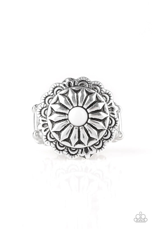 Paparazzi Accessories Daringly Daisy - White A polished white bead is pressed into a glistening silver frame radiating into a floral detail for a seasonal look. Features a stretchy band for a flexible fit. Sold as one individual ring. Jewelry