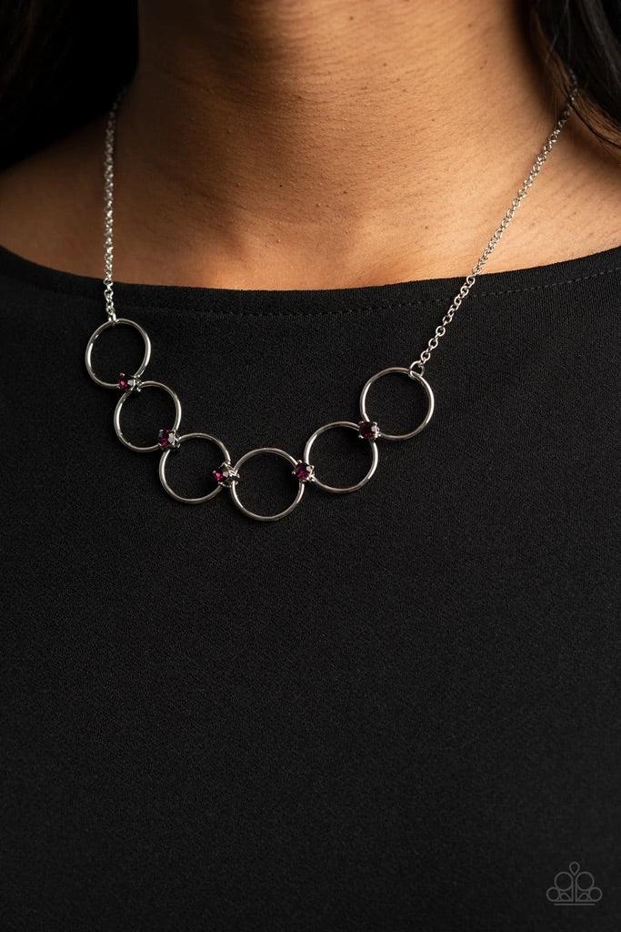 Paparazzi Accessories Regal Society - Purple Glittery purple rhinestones link a dainty row of silver rings below the collar, creating a regal minimalist inspired display. Features an adjustable clasp closure. Sold as one individual necklace. Includes one