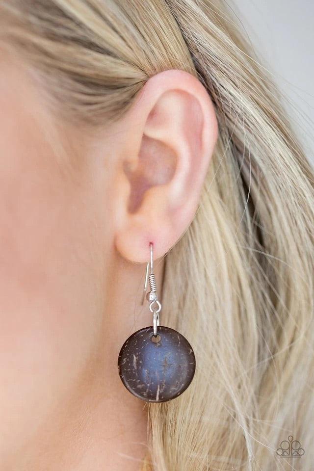 Paparazzi Accessories Cozumel Coast - Red Featuring round, faceted, and distressed finishes, mismatched brown wooden beads are threaded along shiny brown cording. Fiery red wooden beads trickle between the earthy accents, adding a colorful finish to the s