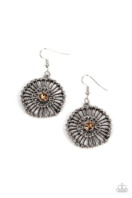 Paparazzi Accessories Tangible Twinkle - Brown Hammered silver spokes flare out from a golden topaz rhinestone center, resulting in a studded silver frame. Earring attaches to a standard fishhook fitting. Sold as one pair of earrings. Earrings