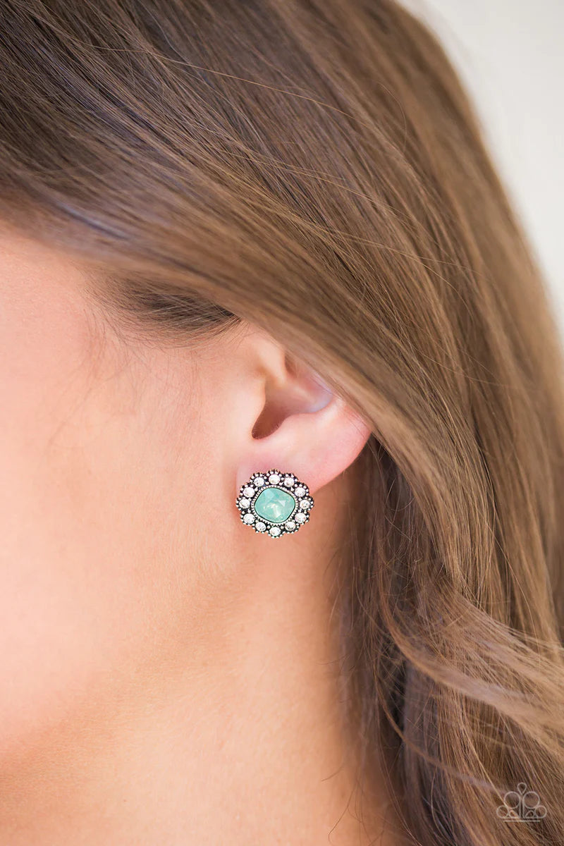 Paparazzi Accessories Little Lady - Green Glittery white rhinestones spin around a glassy green moonstone center for a whimsical look. Earring attaches to a standard post fitting. Sold as one pair of post earrings. Jewelry