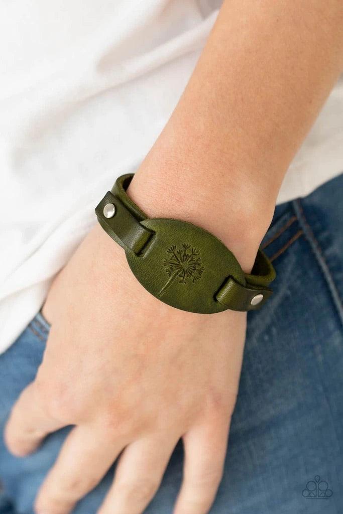 Paparazzi Accessories All Fine and DANDELION - Green Stamped in a rustic dandelion decoration, a piece of green leather is studded in place across the front of a distressed leather band for a whimsically southern look. Features an adjustable sliding knot