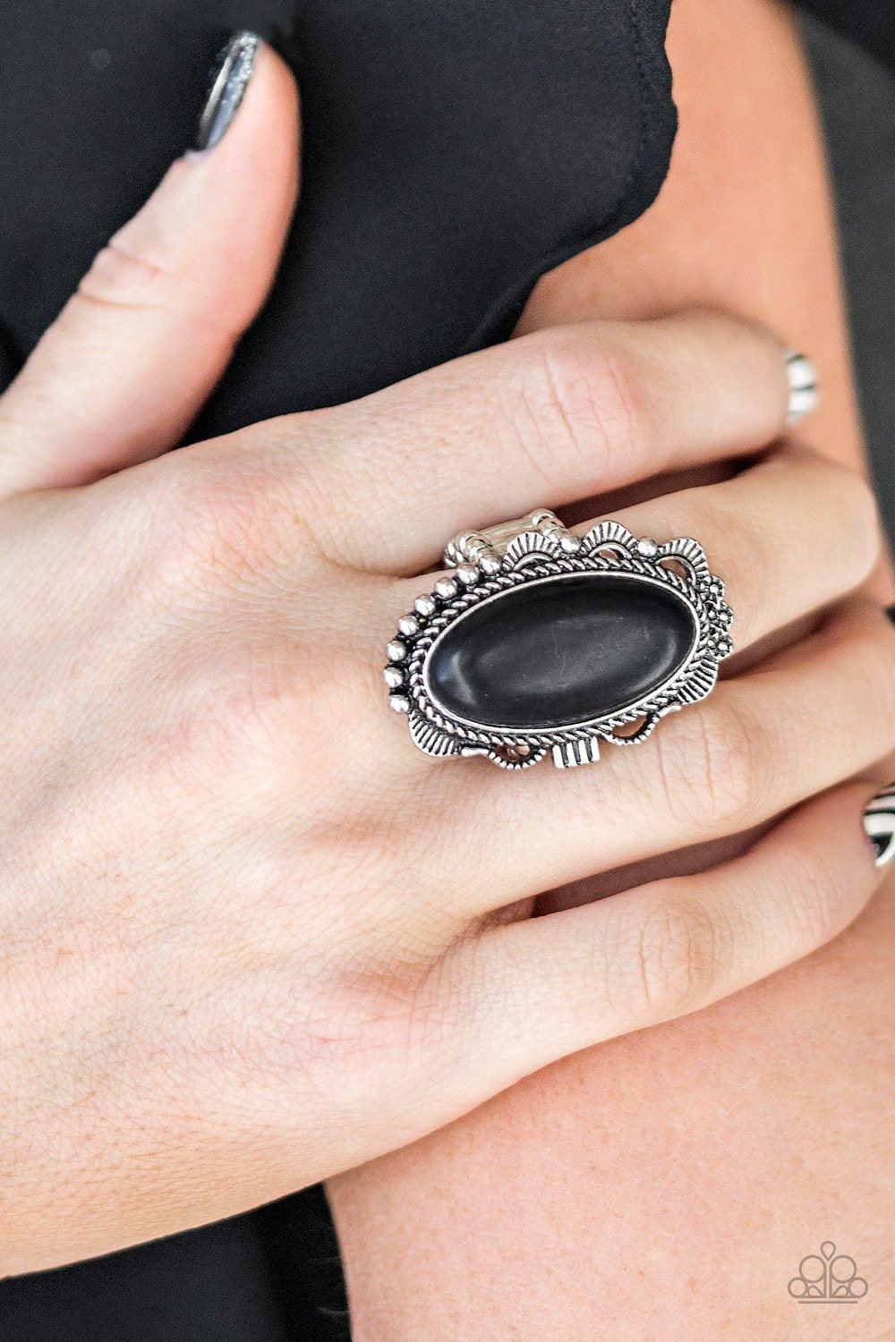 Paparazzi Accessories Open Range - Black An earthy black stone is pressed into an ornate silver frame rippling with studded and serrated textures for a seasonal flair. Features a stretchy band for a flexible fit. Sold as one individual ring. Jewelry