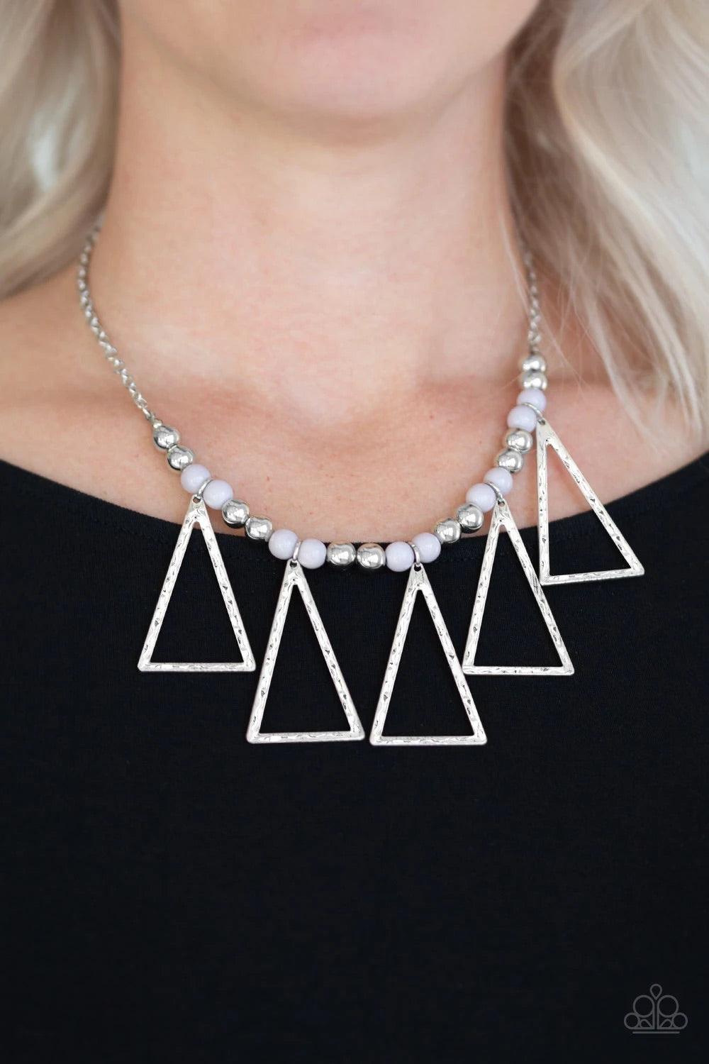 Paparazzi Accessories Terra Nouveau - Silver A collection of shiny silver and polished gray beads are threaded along an invisible wire below the collar. Hammered triangular frames swing from the bottom of the colorful compilation, creating an artistic fri