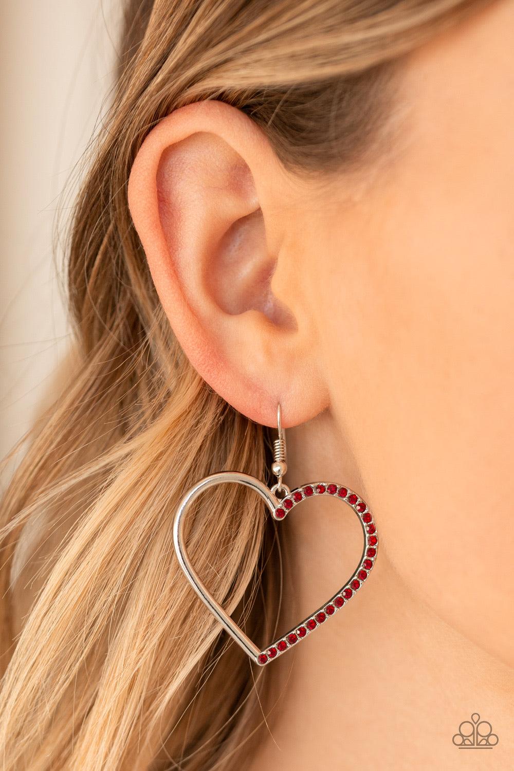 Paparazzi Accessories First Date Dazzle - Red One half of a shimmery silver heart silhouette has been encrusted in glassy red rhinestones, creating a charming frame. Earring attaches to a standard fishhook fitting. Jewelry