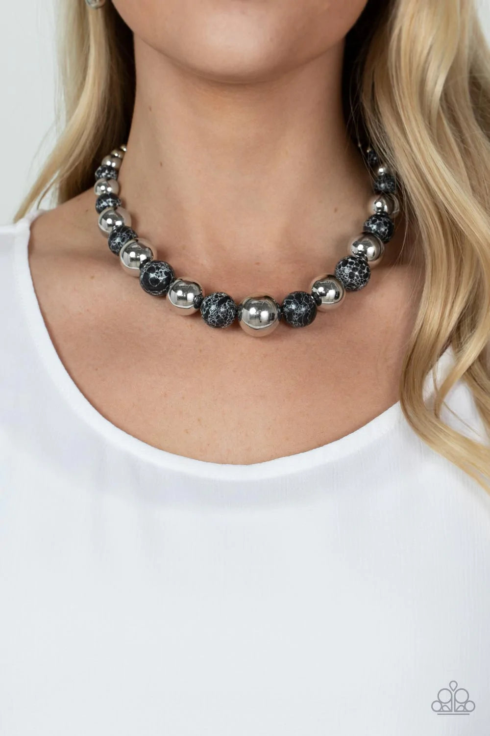 Paparazzi Accessories Stone Age Adventurer - Black Featuring a black and white marble finish, an earthy collection of faux stone and classic silver beads gradually increase in size as they alternate below the collar for a statement-making look. Features a