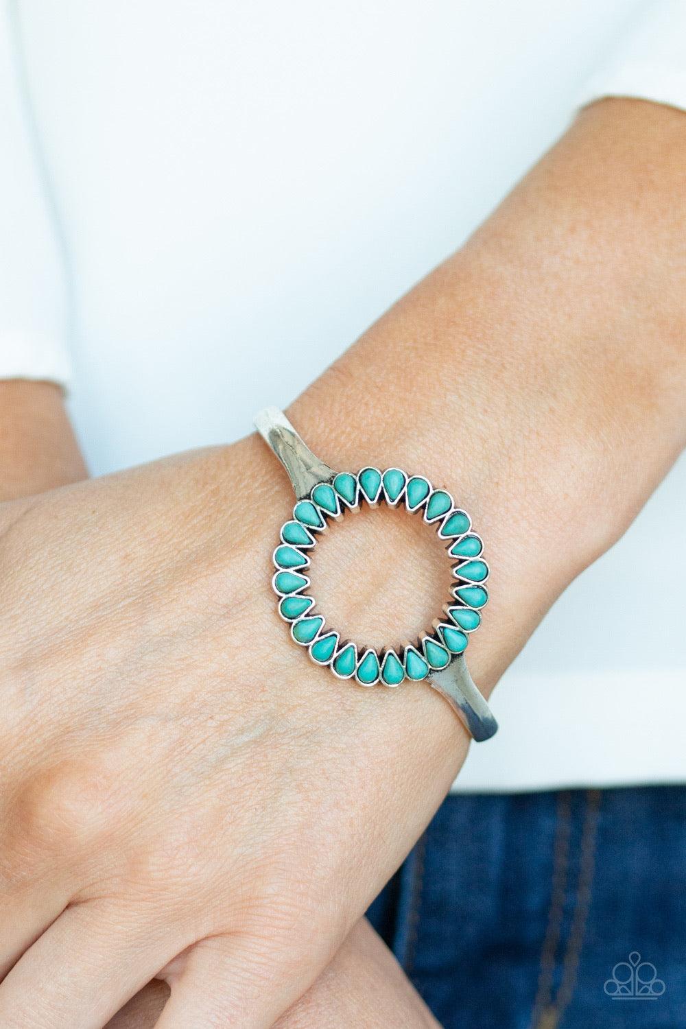 Paparazzi Accessories Divinely Desert - Blue Chiseled into tranquil teardrops, earthy turquoise stones spin around the center of an antiqued silver cuff for a seasonal look. Jewelry