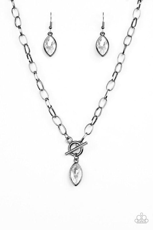 Paparazzi Accessories Club Sparkle - Black Featuring a regal marquise style cut, a glittery white rhinestone swings from the bottom of a gunmetal chain below the collar for a classic look. Features a toggle closure. Sold as one individual necklace. Includ