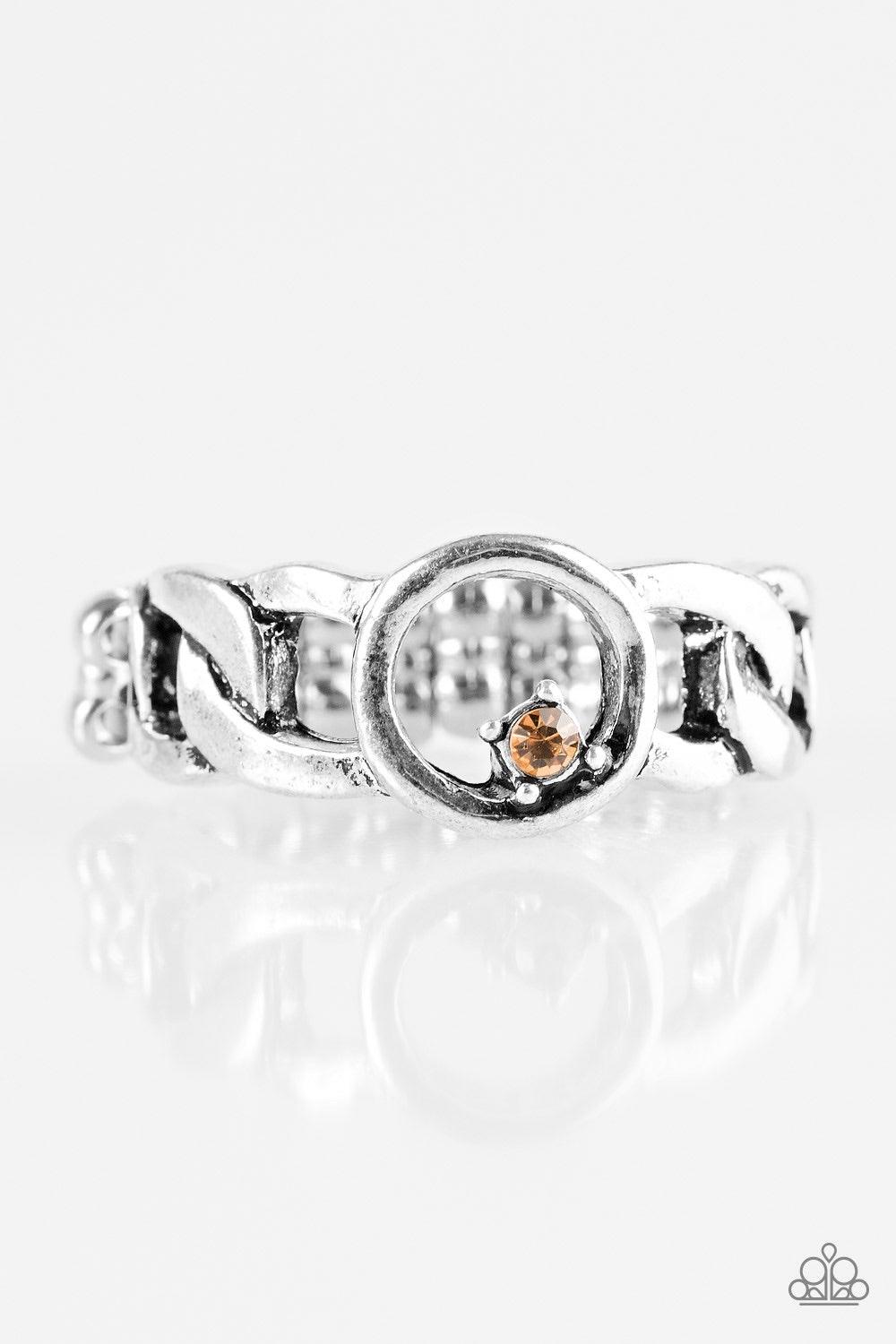 Paparazzi Accessories Rogue Sparkle - Brown Antiqued silver links join across the finger, creating an edgy band. A dainty topaz rhinestone asymmetrically dots the center link for a sassy finish. Features a dainty stretchy band for a flexible fit. Jewelry