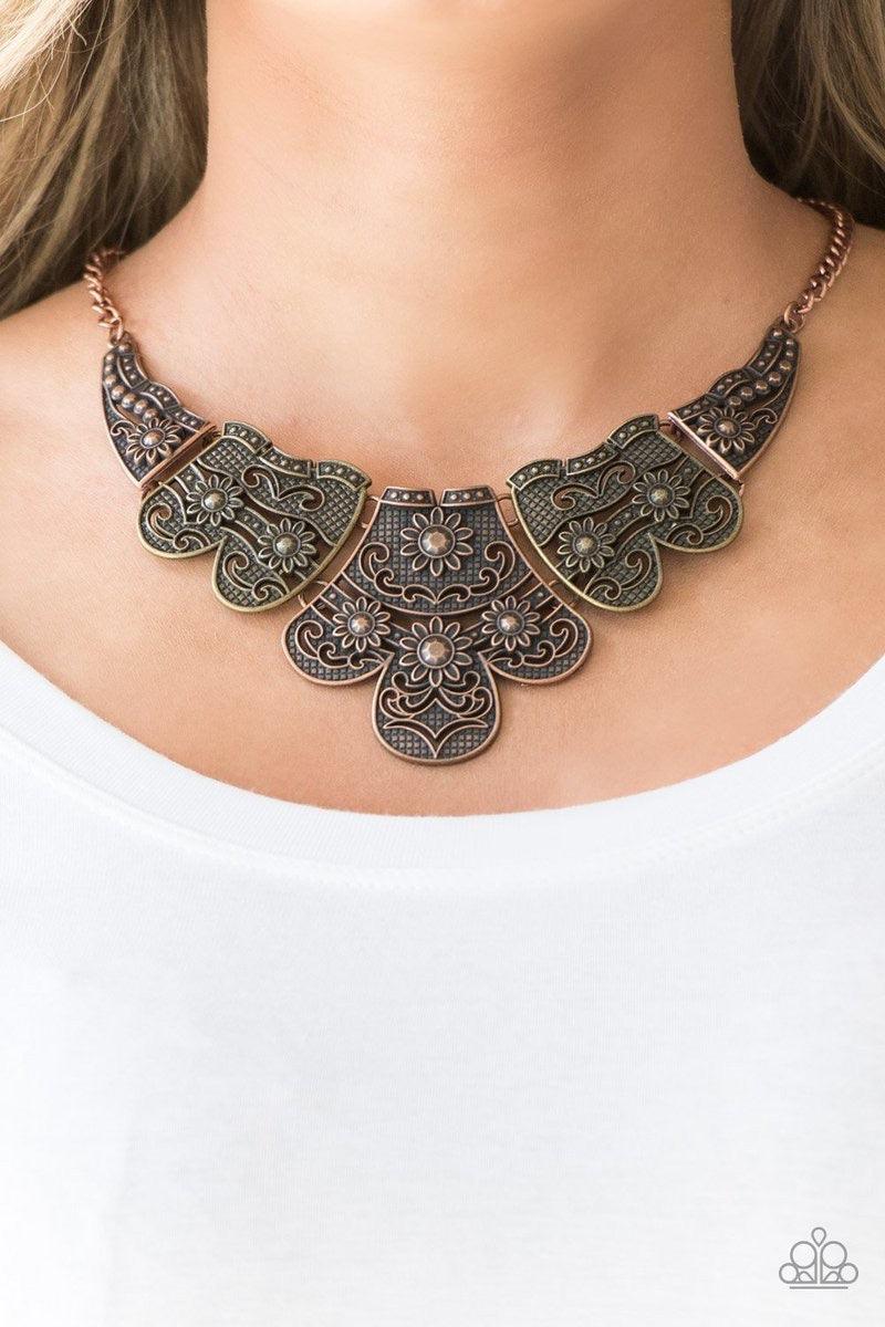 Paparazzi Accessories Mess With The Bull - Multi Embossed in whimsical floral detail, antiqued brass and copper plates connect below the collar for a statement making look. Features an adjustable clasp closure. Sold as one individual necklace. Includes on