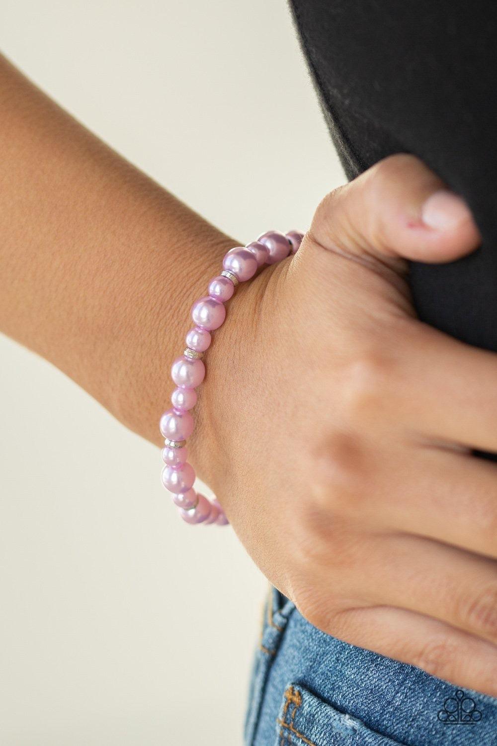 Paparazzi Accessories Powder and Pearls - Purple Infused with dainty silver accents, a collection of dainty and classic purple pearls are threaded along a stretchy band around the wrist for a timeless look. Jewelry