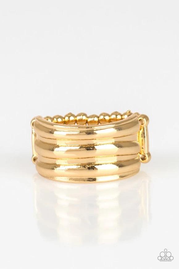 Paparazzi Accessories Rough Around The Edges - Gold Brushed in a high-sheen finish, ribbed gold bands stack across the finger for an edgy industrial look. Features a stretchy band for a flexible fit. Sold as one individual ring. Jewelry