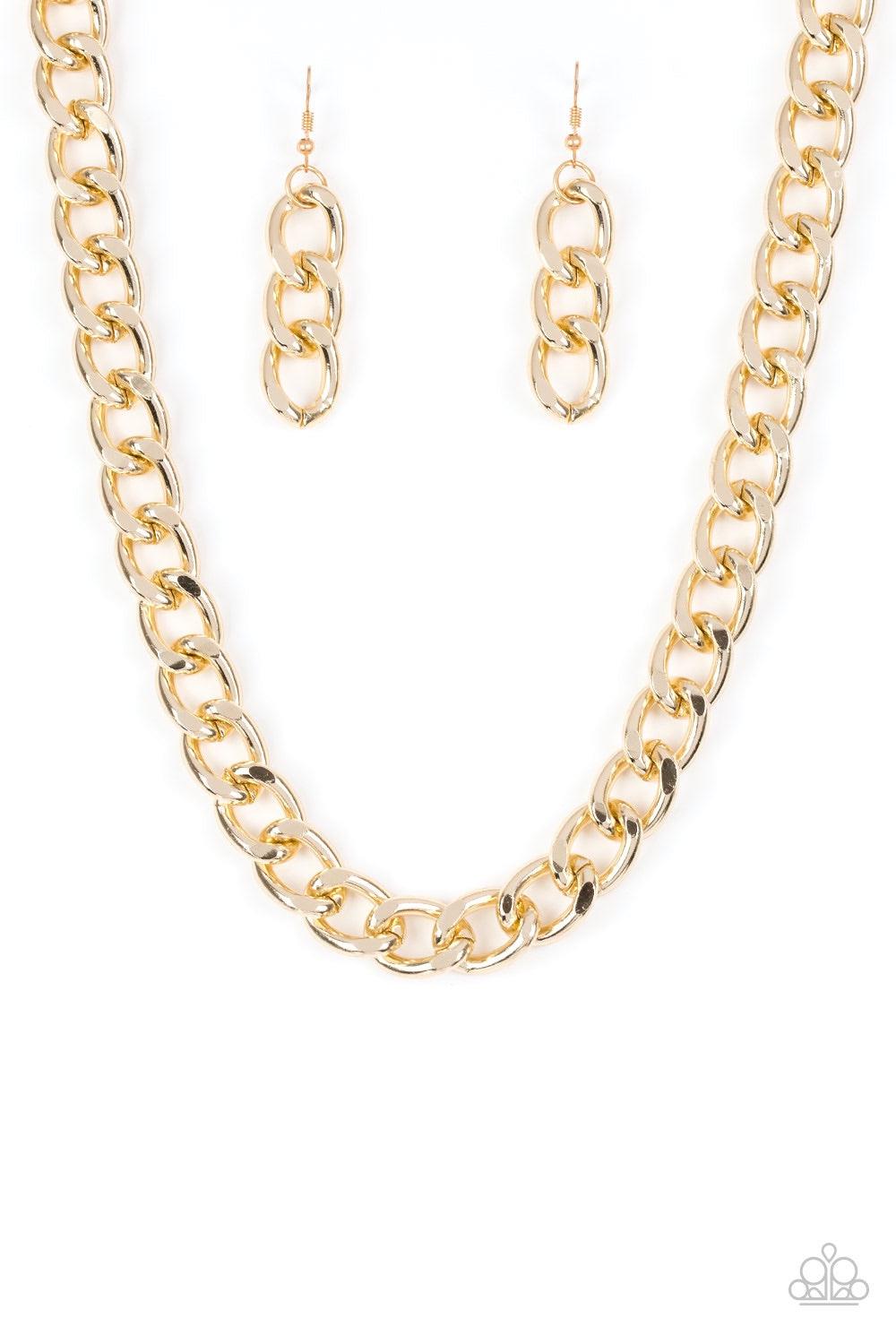 Paparazzi Accessories Heavyweight Champion - Gold Brushed in a high-sheen shimmer, a bold gold chain drapes below the collar in an edgy industrial fashion. Features an adjustable clasp closure. Jewelry