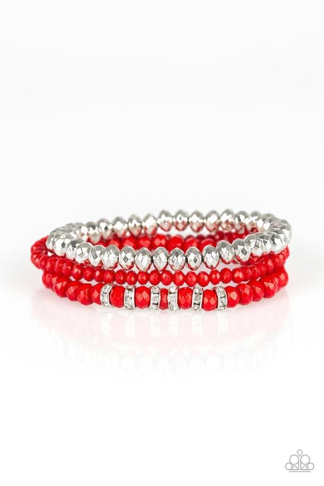 Paparazzi Accessories Ideal Idol - Red A collection of faceted red and silver beads are threaded along stretchy bands around the wrist. White rhinestone encrusted rings are added to one strand for a refined finish. Jewelry