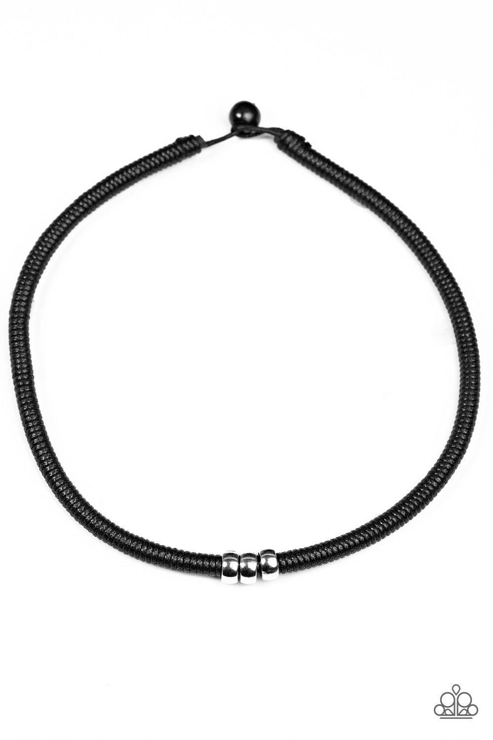 Paparazzi Accessories Trail Rules - Black Shiny black twine wraps around a black cord, creating an urban look below the collar. Shiny silver beads slide along the cording for a rugged finish. Features a button loop closure. Jewelry