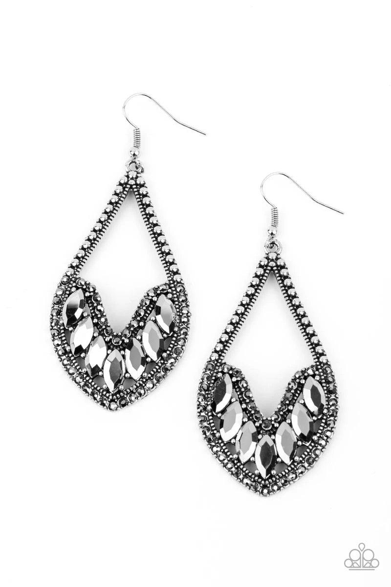 Paparazzi Accessories Ethereal Expressions - Silver Bordered in sections of dainty hematite rhinestones and antiqued silver studs, the bottom of an elongated silver teardrop is embellished in edgy marquise style hematite rhinestones for an epic finish. Ea