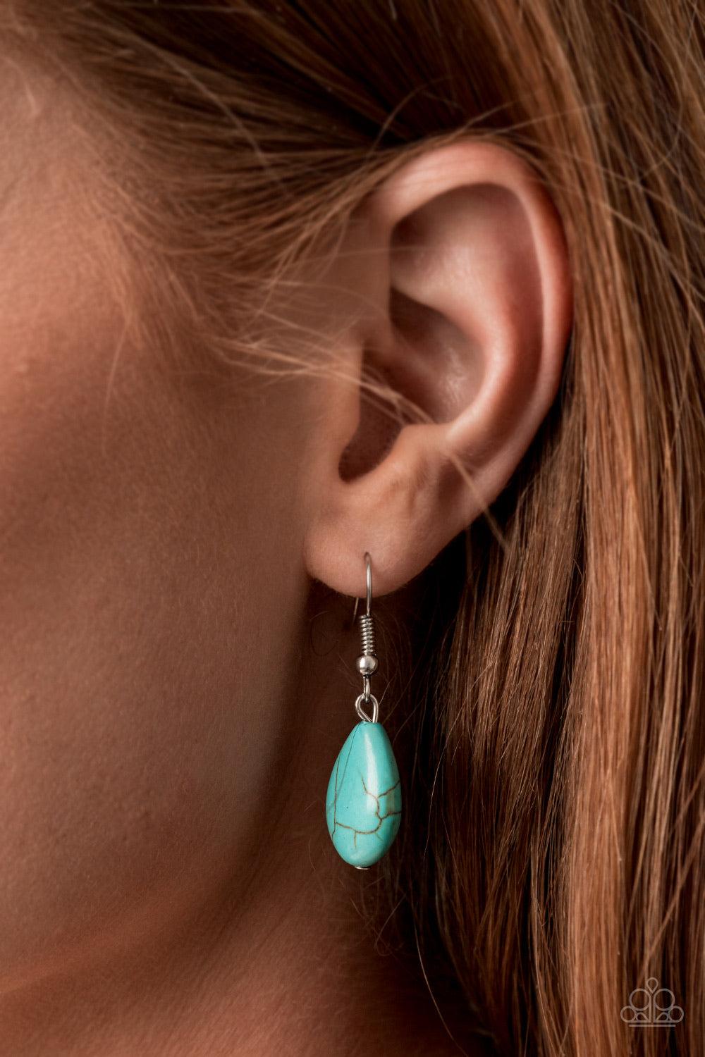 Paparazzi Accessories Rural Rapture - Blue Linked by handcrafted fittings, a pair of imperfect turquoise stones are pressed into asymmetrical hammered silver frames as they stack below the collar. Oversized silver links and a pair of hammered links form i