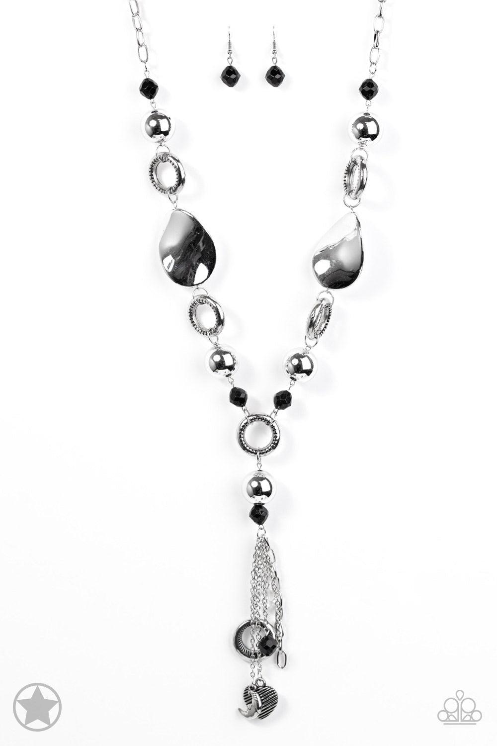 Paparazzi Accessories Total Eclipse Of The Heart - Silver Long chain of black crystalized beads, curved plates of silver with a pearly finish, and chunky silver rings lead down to a tassel of chains and charms, including a crescent moon and a heart. Jewel
