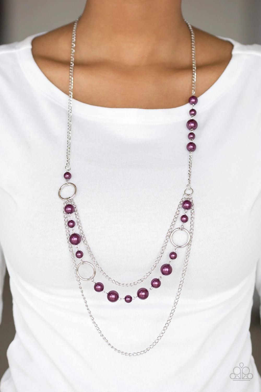 Paparazzi Accessories Party Dress Princess - Purple Pearly purple beads and shimmery silver hoops trickle along glistening silver chains, creating mismatched layers down the chest. Features an adjustable clasp closure. Jewelry