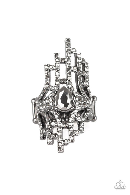 Paparazzi Accessories Modern Muse - Black Encrusted with glittery hematite rhinestones, a collection of gunmetal bars radiate from a teardrop hematite rhinestone center for an edgy stacked look. Features a stretchy band for a flexible fit. Jewelry