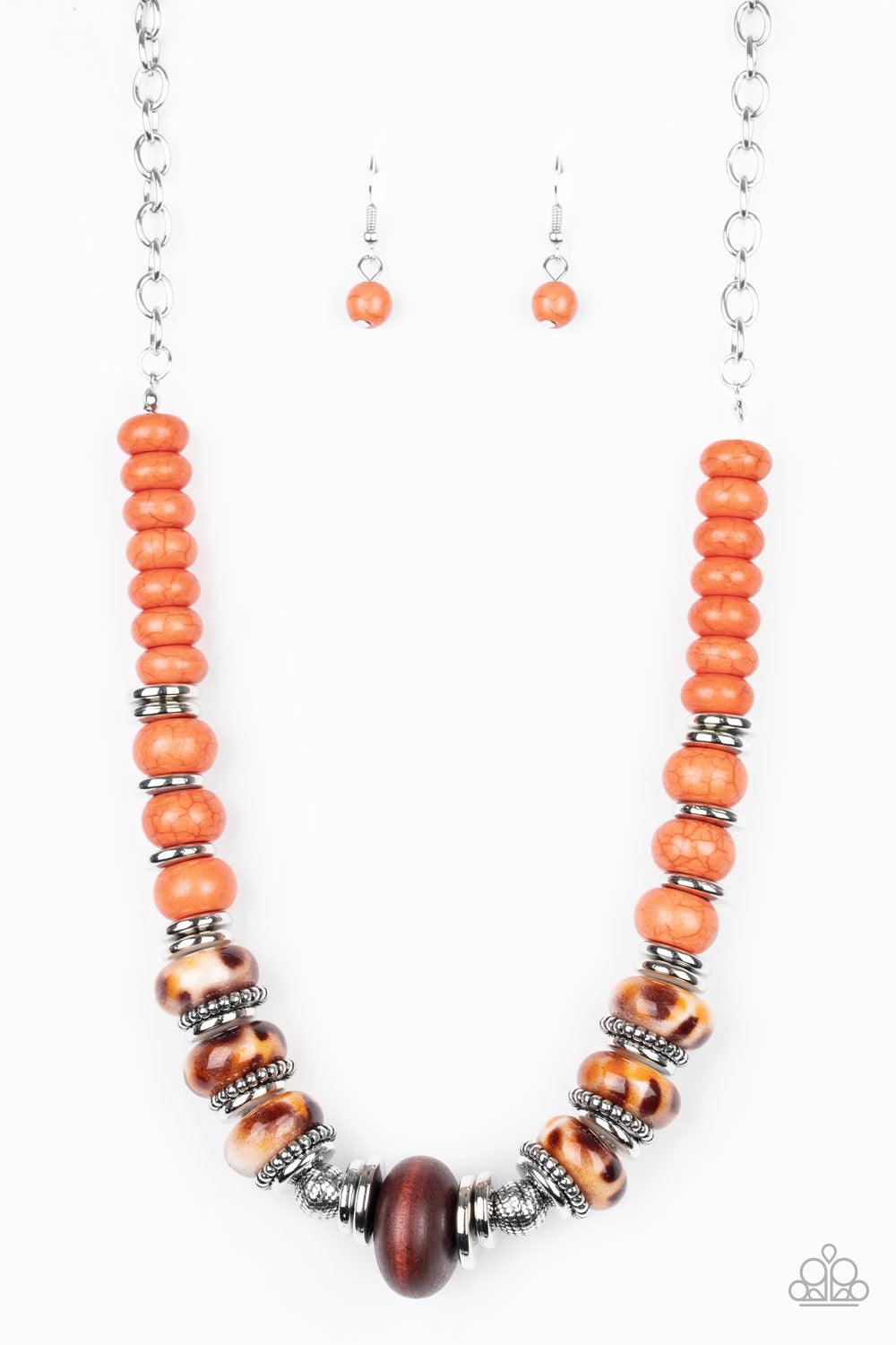 Paparazzi Accessories Desert Tranquility - Orange An earthy collection of dainty silver accents, rounded orange stone beads, and spotted ceramic-like beads are threaded along an invisible wire below the collar. An earthy wooden bead adorns the center, add