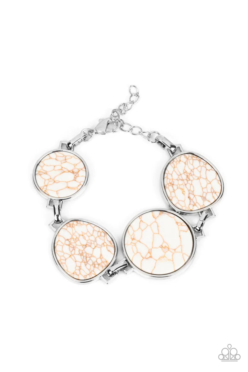 Paparazzi Accessories Flat Out Frontier - White Flat white marbled stones pressed into shiny-silver frames provide a statement focal point around the wrist. Features an adjustable clasp closure. As the stone elements in this piece are natural, some color