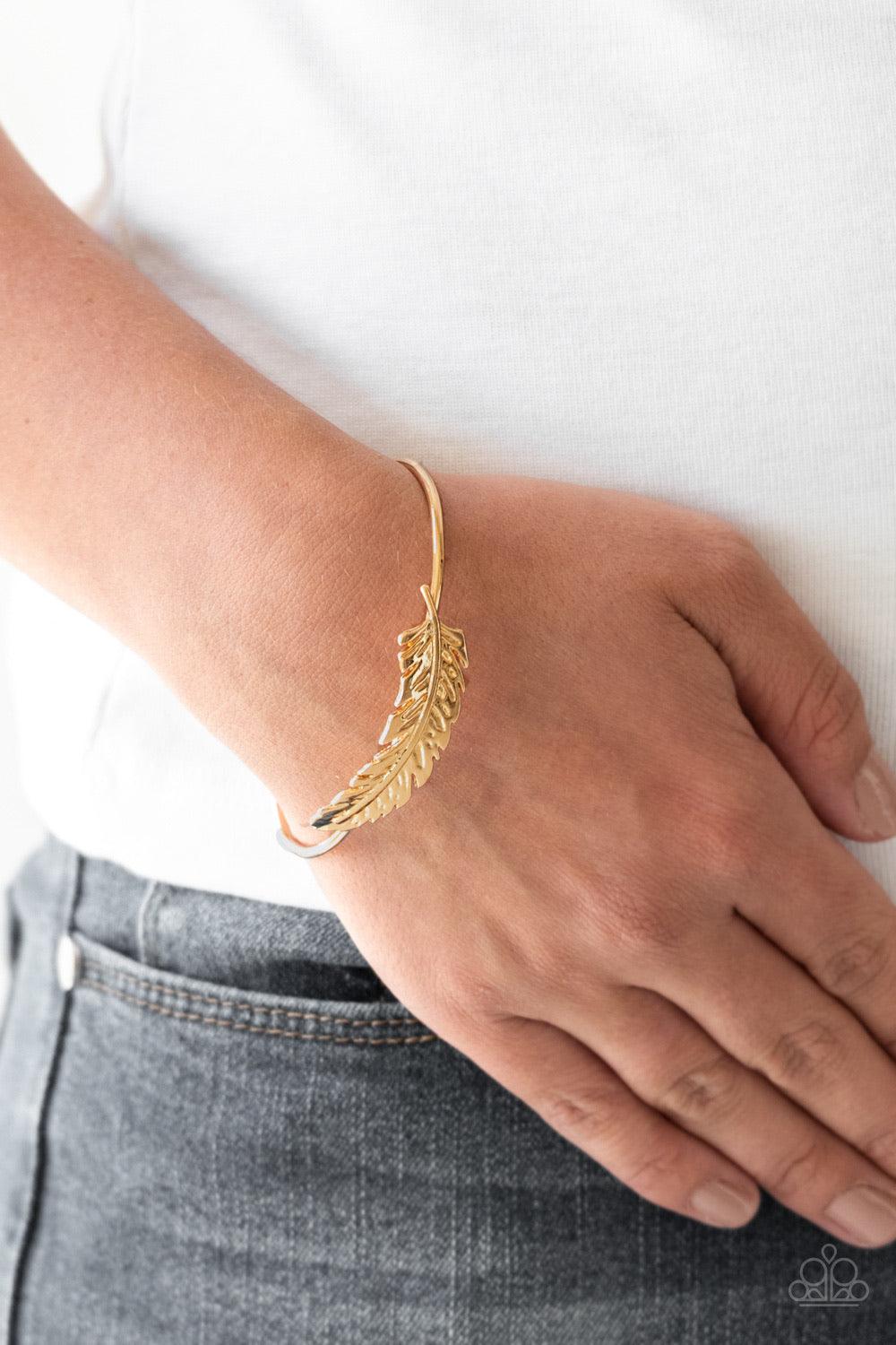 Paparazzi Accessories How Do You Like This FEATHER? - Gold Featuring life-like detail, a shimmery gold feather folds along a dainty silver cuff for a seasonal look. Jewelry