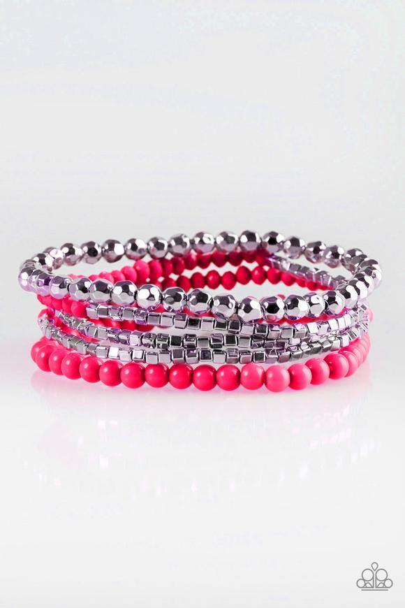 Paparazzi Accessories Colorfully Chromatic - Pink Refreshing pink, faceted silver, and square silver beads are threaded along stretchy elastic bands, creating colorful mismatched layers across the wrist. Jewelry