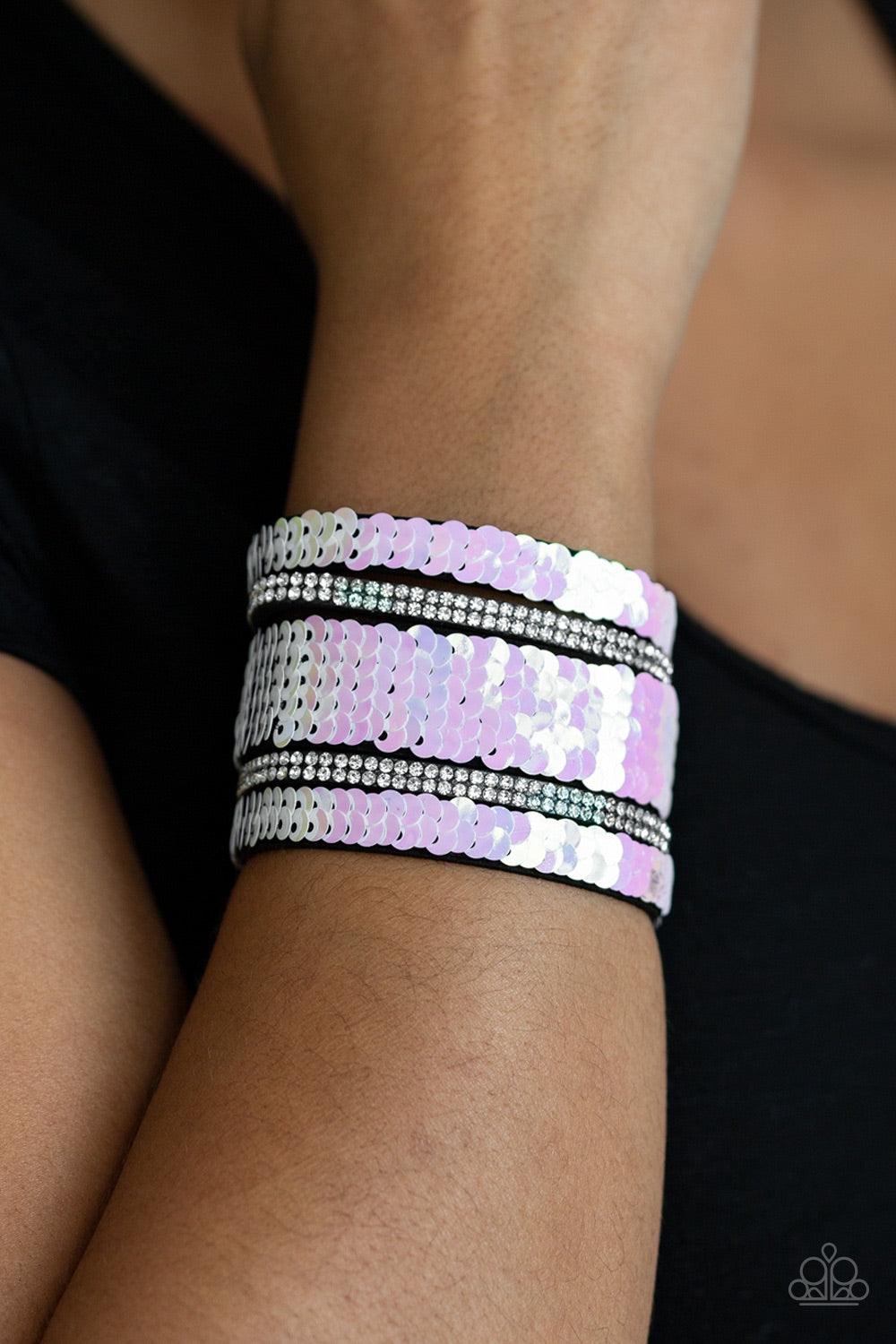 Paparazzi Accessories MERMAID Service - White Infused with strands of blinding white rhinestones, row after row of shimmery sequins are stitched across the front of a spliced black suede band. Bracelet features reversible sequins that change from white to