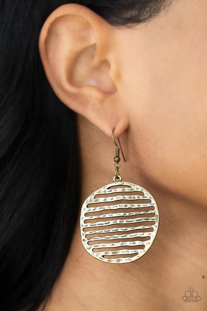Paparazzi Accessories Sunrise Stunner - Brass Brushed in an antiqued brass finish, lightly hammered bars stack inside an airy circular frame, creating a wavy rustic lure. Earring attaches to a standard fishhook fitting. Sold as one pair of earrings. Jewel