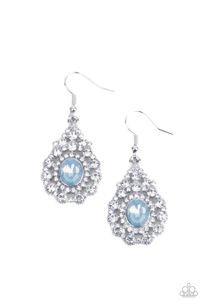 Paparazzi Accessories Celestial Charmer - Blue Bordered in a ring of dainty white rhinestones, an opalescent blue gem adorns the center of a teardrop frame radiating with glassy white rhinestones for an ethereally elegant look. Earring attaches to a stand