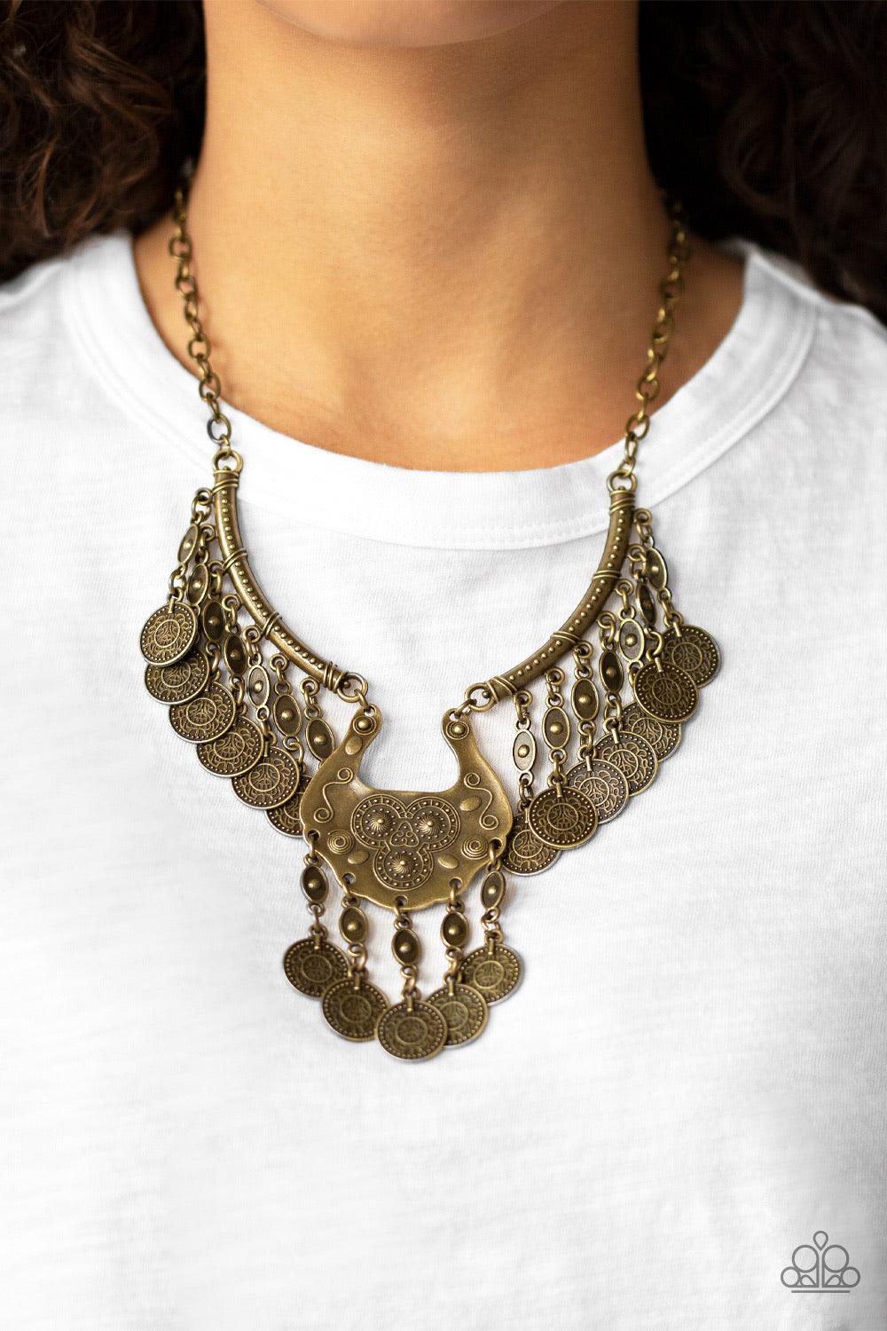 Paparazzi Accessories Treasure Temptress - Brass Brass coin-like accents dangle from the bottom of three ornate brass plates, creating a noise-making fringe below the collar. Features an adjustable clasp closure. Jewelry