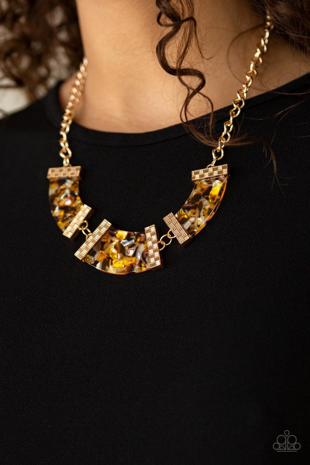 Paparazzi Accessories HAUTE Blooded - Yellow A trio of speckled acrylic frames are nestled inside checker textured gold fittings as they link below the collar for a seasonal flair. Features an adjustable clasp closure. Jewelry