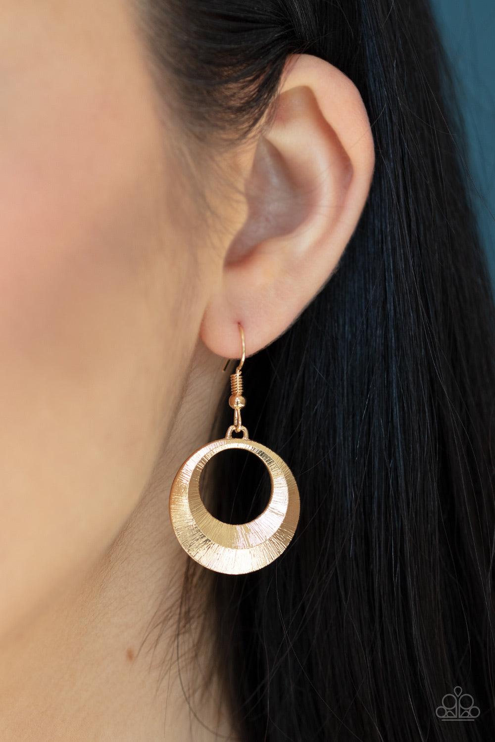 Paparazzi Accessories Egyptian Eclipse - Gold Featuring a blinding scratch finish, two beveled gold circular frames swing from the bottom of a bowing gold rod, creating an edgy stacked pendant down the chest. Features an adjustable clasp closure. Jewelry