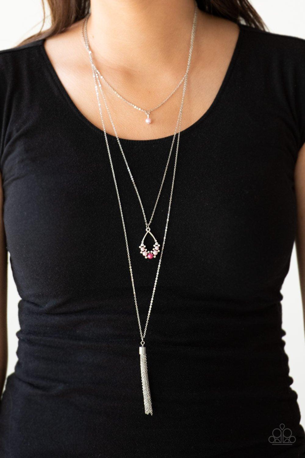 Paparazzi Accessories Be Fancy - Multi A solitaire pink pearl swings from the uppermost chain, giving way to a teardrop pendant and shimmery silver chain tassel. Dainty white rhinestones and pink pearls collect at the bottom of the centermost pendant for