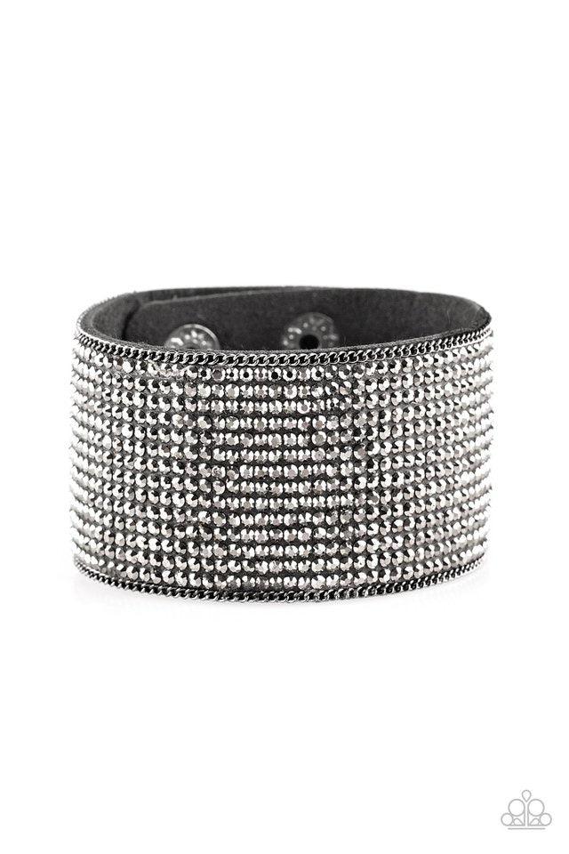 Paparazzi Accessories Glitter Gossip - Black Row after row of glittery hematite rhinestones are encrusted along a thick black suede band, creating blinding shimmer across the wrist. Features an adjustable snap closure. Sold as one individual bracelet. Jew