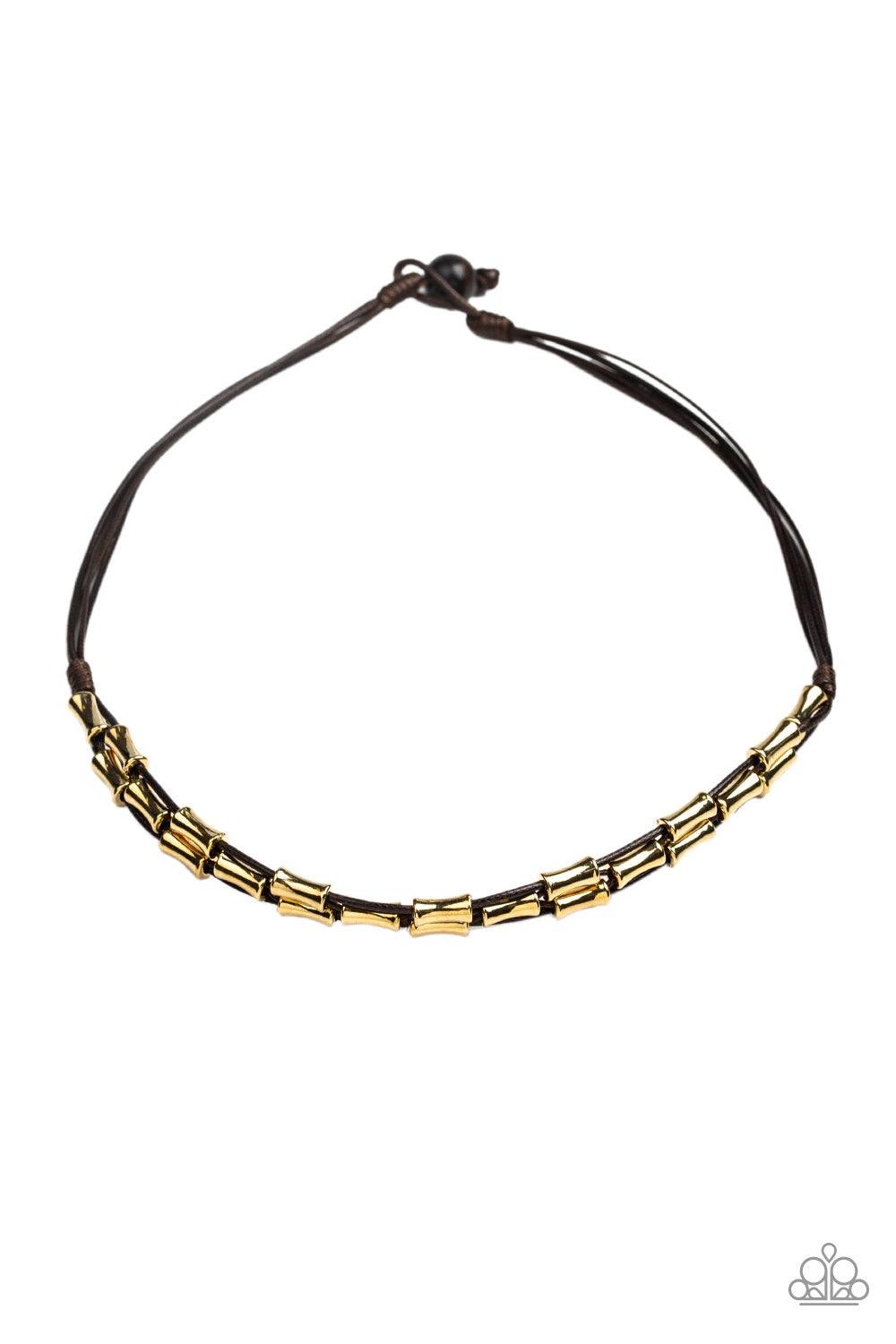 Paparazzi Accessories Moto Maverick - Brown Shiny brown cording weaves through a collection of glistening gold beads below the collar for an edgy, urban look. Features a button loop closure. Jewelry