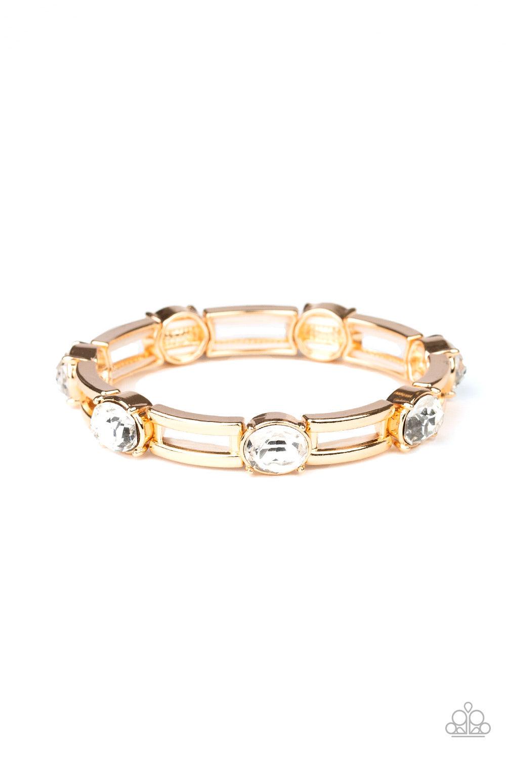 Paparazzi Accessories Flash or Credit? - Gold A glittery collection of white rhinestones and airy rectangular gold frames are threaded along stretchy bands around the wrist for a glitzy look. Sold as one individual bracelet. Jewelry
