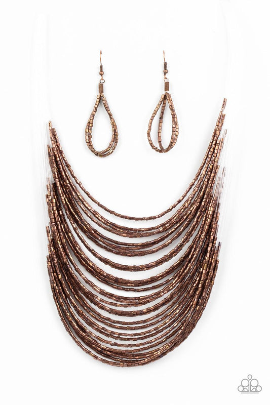Paparazzi Accessories Catwalk Queen - Copper Strand after strand of metallic copper seed beads fall together to create a bold statement piece. Features an adjustable clasp closure. Sold as one individual necklace. Includes one pair of matching earrings. J