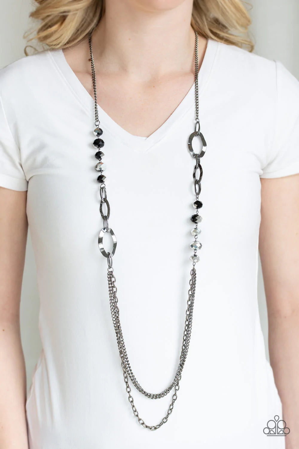 Paparazzi Accessories Modern Girl Glam - Black Dipped in metallic shimmer, a collection of black crystal-like beads and hammered gunmetal frames give way to layers of mismatched gunmetal chains for a modern look. Features an adjustable clasp closure. Sold