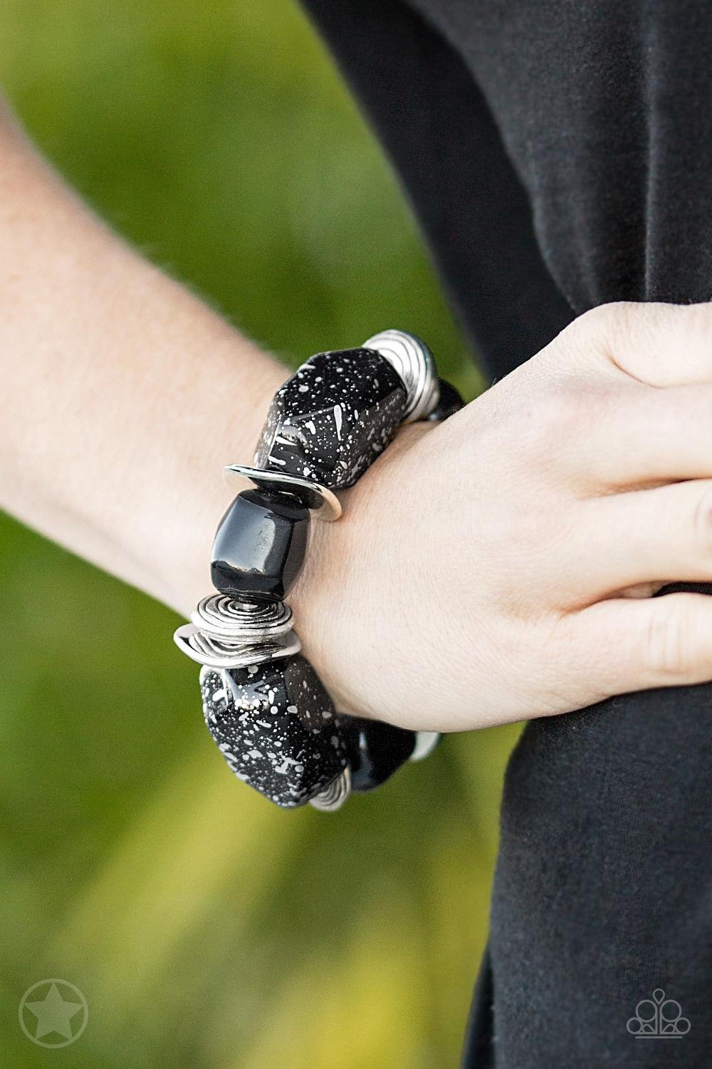Paparazzi Accessories Glaze of Glory - Black Chunky black beads with speckles of silver and a gorgeous glazed finish are threaded along a stretchy band with thick silver rings. Jewelry