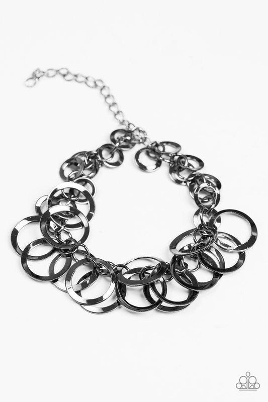 Paparazzi Accessories Circus Cabaret - Black Glistening gunmetal hoops swing from a bold gunmetal chain, creating a flirty fringe around the wrist. Features an adjustable clasp closure. Sold as one individual bracelet. Jewelry