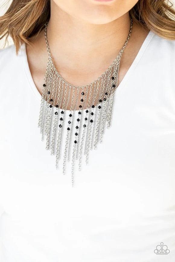 Paparazzi Accessories First Class Fringe - Black Varying in length, mismatched silver chains stream from the bottom of a classic silver chain. Faceted black crystal-like beads sporadically dot the free-falling chains, creating a statement-making fringe be