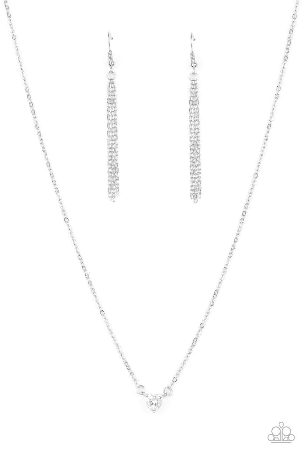 Paparazzi Accessories Heartbeat Bling - White A dainty heart-shaped white cubic zirconia swings below the collar for a timelessly romantic look. Features an adjustable clasp closure. Sold as one individual necklace. Includes one pair of matching earrings.