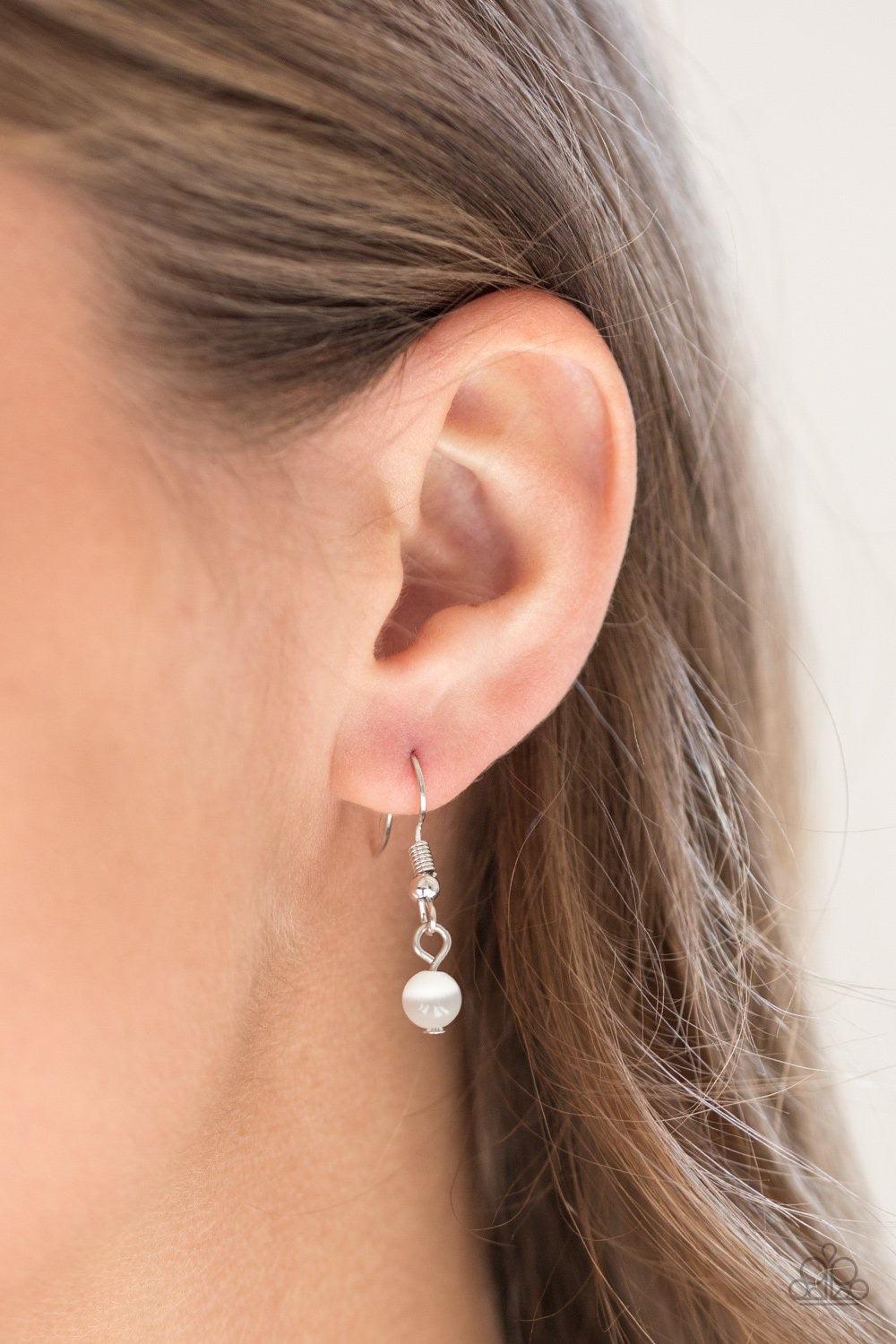 Paparazzi Accessories Happy As Can BEAM - White *Lanyard Infused with white rhinestone encrusted fittings, a glowing white moonstone pendant swings from the bottom of a rounded silver mesh chain for a whimsical look. A lobster clasp hangs from the bottom