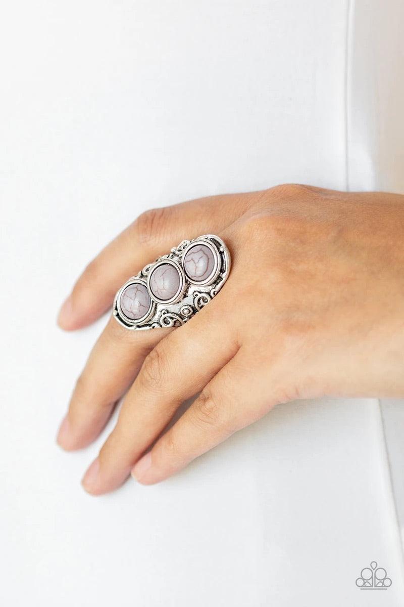 Paparazzi Accessories Sahara Soul - Silver Three neutral gray stones are pressed down the center of an ornate silver frame embossed in swirling filigree for a seasonal look. Features a stretchy band for a flexible fit. Sold as one individual ring. Jewelry