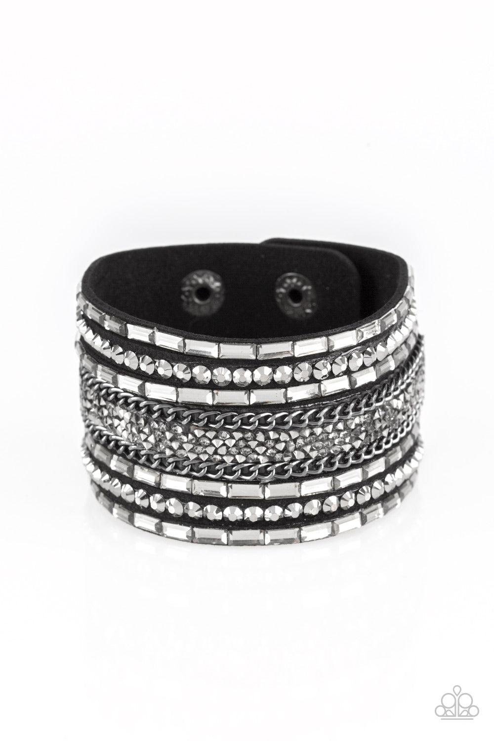 Paparazzi Accessories Rhinestone Rumble ~Black Smoky emerald-cut rhinestones, hematite rhinestones, and metallic prism-shaped rhinestones are sprinkled along strands of black suede. Shimmery gunmetal chain is added to the mix for a sassy industrial finish