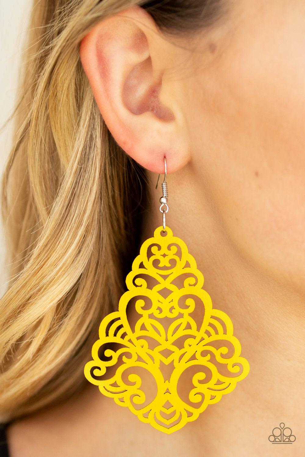 Paparazzi Accessories Powers of Zen - Yellow Painted in a shiny yellow finish, an airy wooden frame swirling with filigree detail swings from the ear for a seasonal look. Earring attaches to a standard fishhook fitting. Jewelry